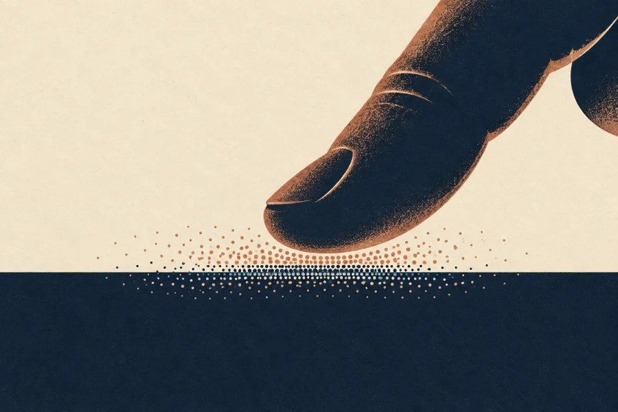An illustrated fingertip presses a tabletop as two fields of atomic dots meet at the surface.