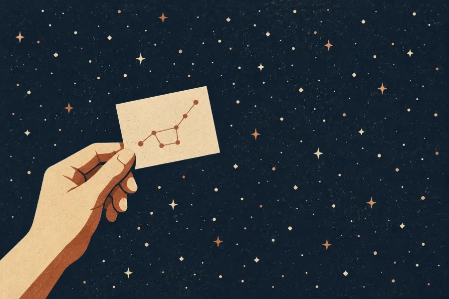 A hand holds a small connected constellation against a field of scattered stars